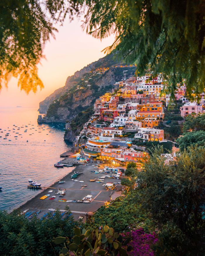Positano Sunset – Amalfi Coast Luxury View Breathtaking view of Positano's colorful cliffside homes at sunset.